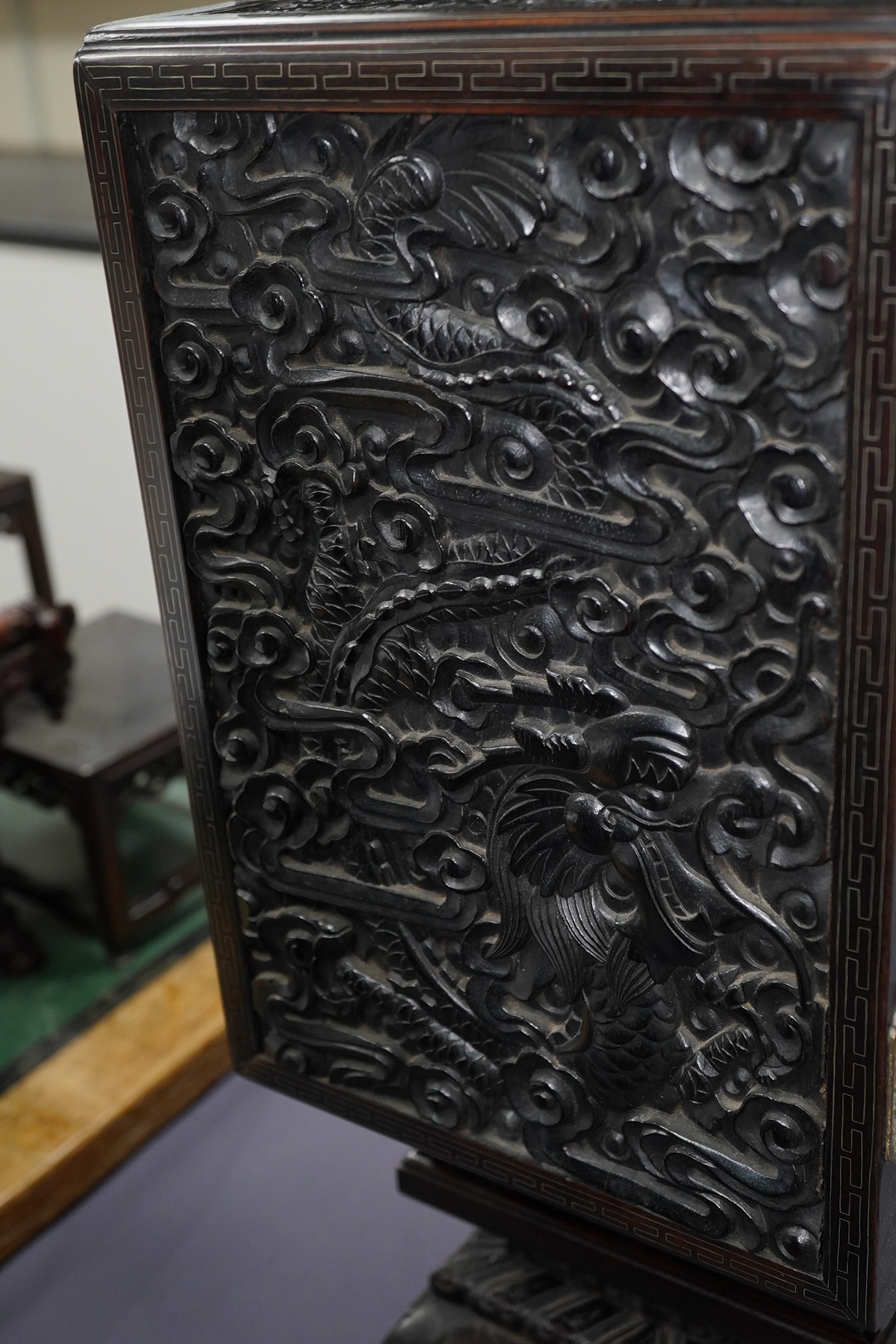 An important pair of Chinese carved zitan and silver wire inlaid ‘cloud and dragon’ curio cabinets and stands, duobaoge, probably Imperial, late Qing dynasty